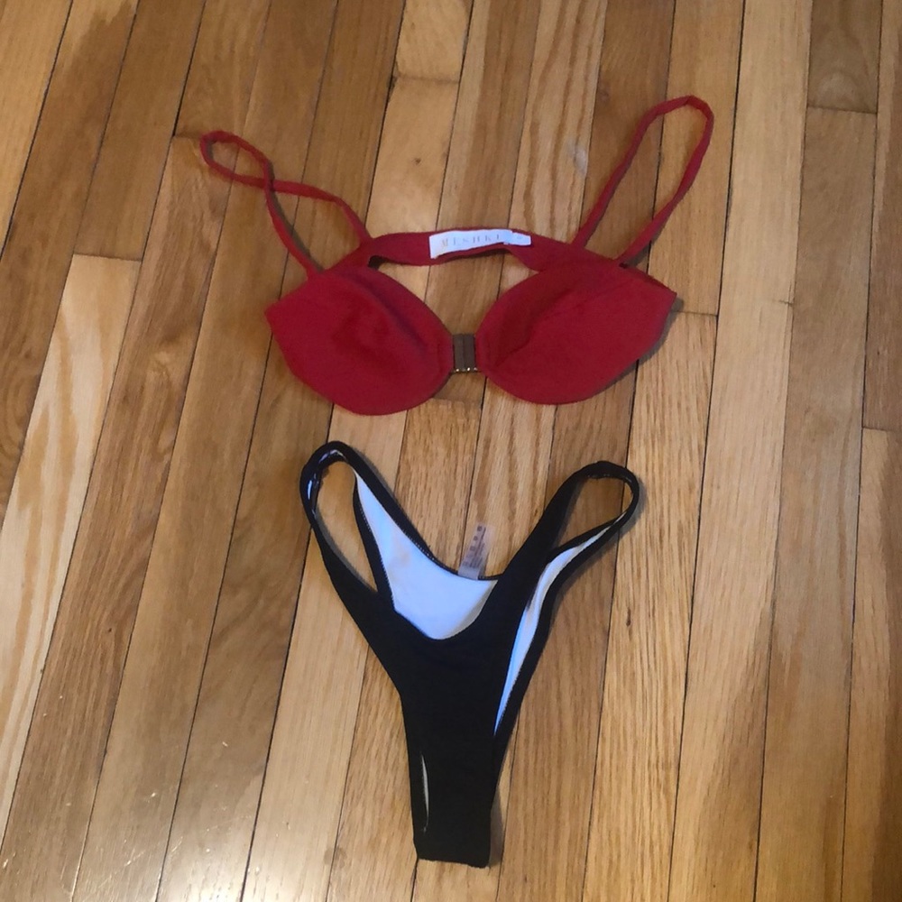 Women’s bikini red top by Meshki and black bottoms by Shein